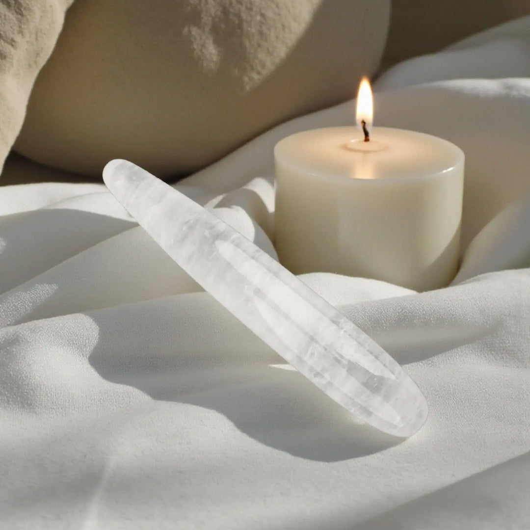 Clear quartz crystal pleasure wand by Emma Donghai, showcasing light clarity and smooth, elegant design.