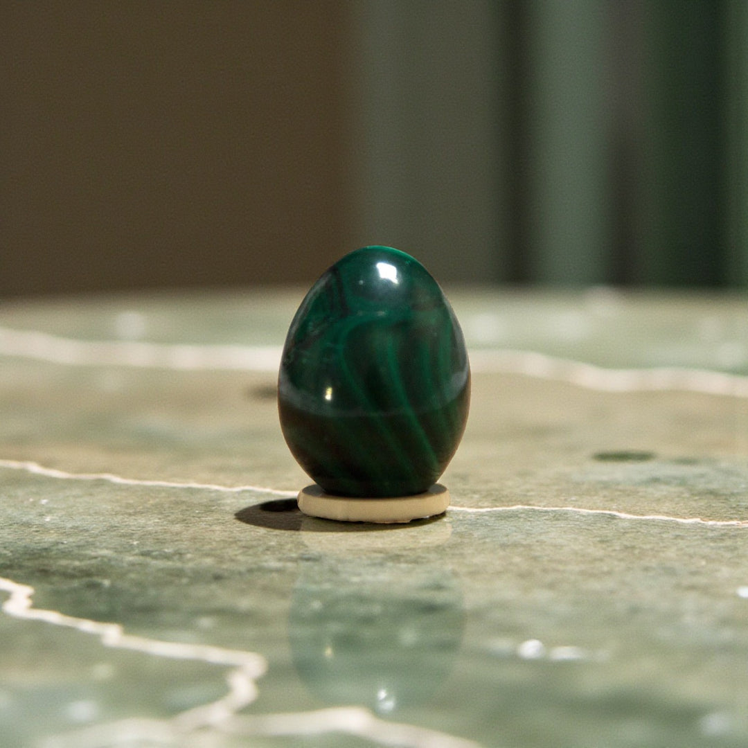 Jade nephrite Yoni eggs. A sacred practice for feminine strength, healing, and embodiment. from Gaiae Sydney.on jade marble bench 