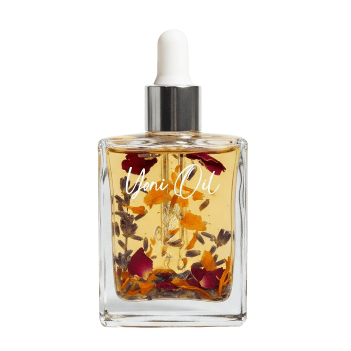 Hand holding a glass dropper bottle with a white cap against a white  Gaiae_Natural_Yoni_oil_Vulva_Oilbackground