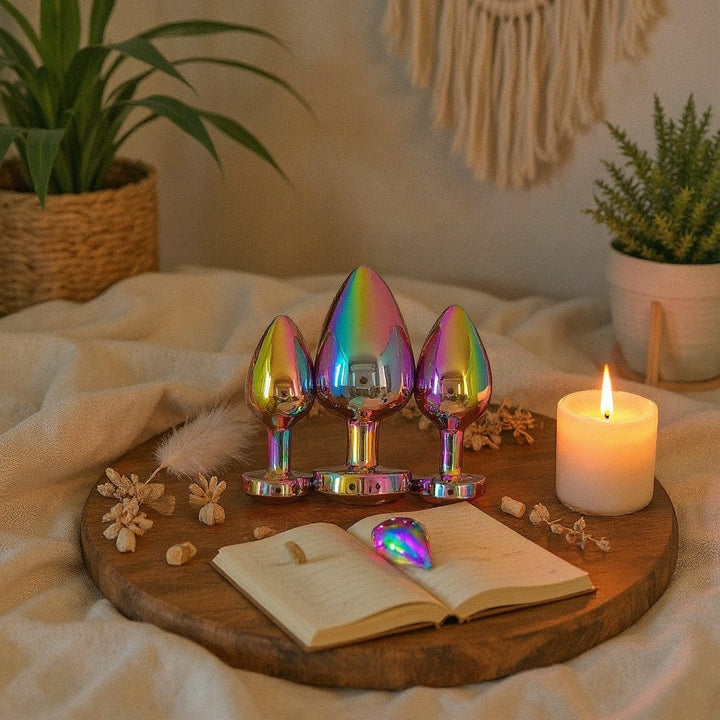 Gaia rainbow stainless steel heart butt plug set of 3. Smooth, sleek, teardrop shape, perfect for beginners. Includes small, medium, and large sizes.