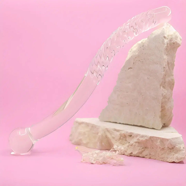 Cervical massage • G-Spot • Long Glass Wand • Gaiae sittong on pink background and natural stone