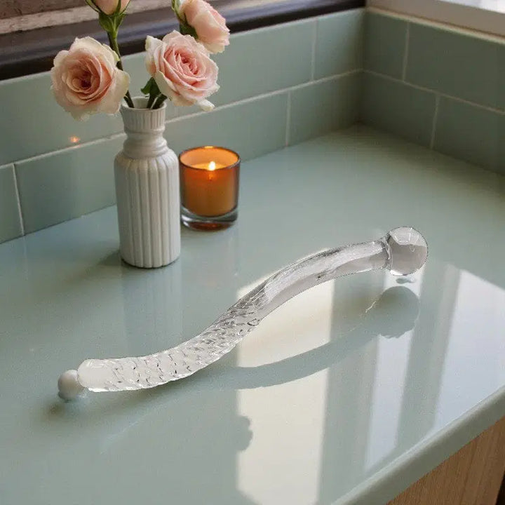 Cervical massage • G-Spot • Long Glass Wand • Gaiae green marble table with candles and flowers in background set the mood