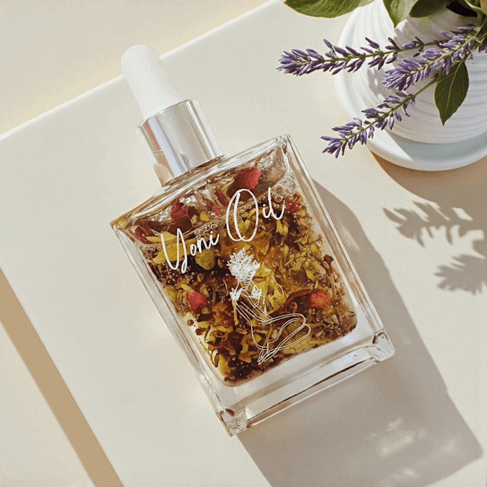 Natural Yoni Oil (Vulva Oil) in a glass dropper bottle with dried botanicals and flowers Gaiae Jade Yoni Egg Ritual Set • Nervous System Regulation 