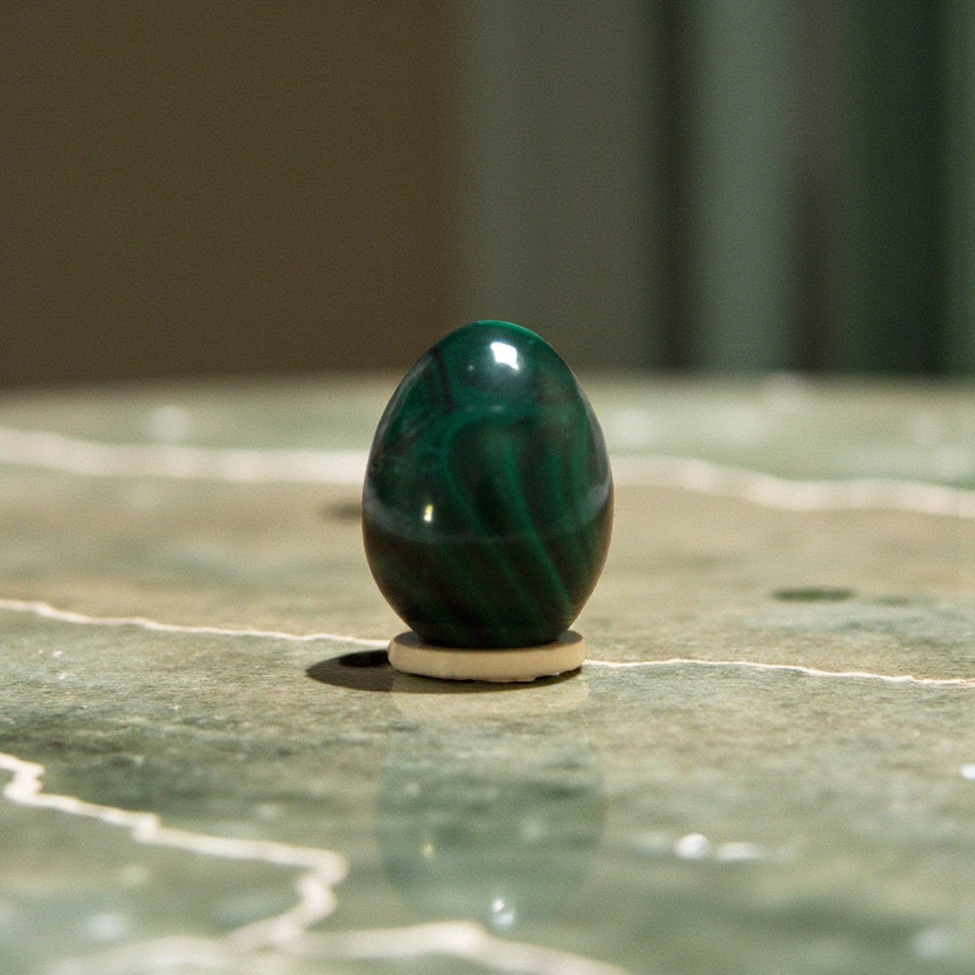 Jade Yoni Eggs displayed on a marble surface, symbolizing feminine strength and healing.