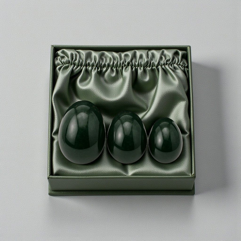 Gaiae Jade Yoni eggs in a gift box, dark green box holding the set of a dark green Jade yoni egg for womb healing ritual